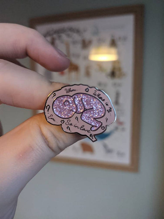Baby Brain Pin Badge by Donwood Creations